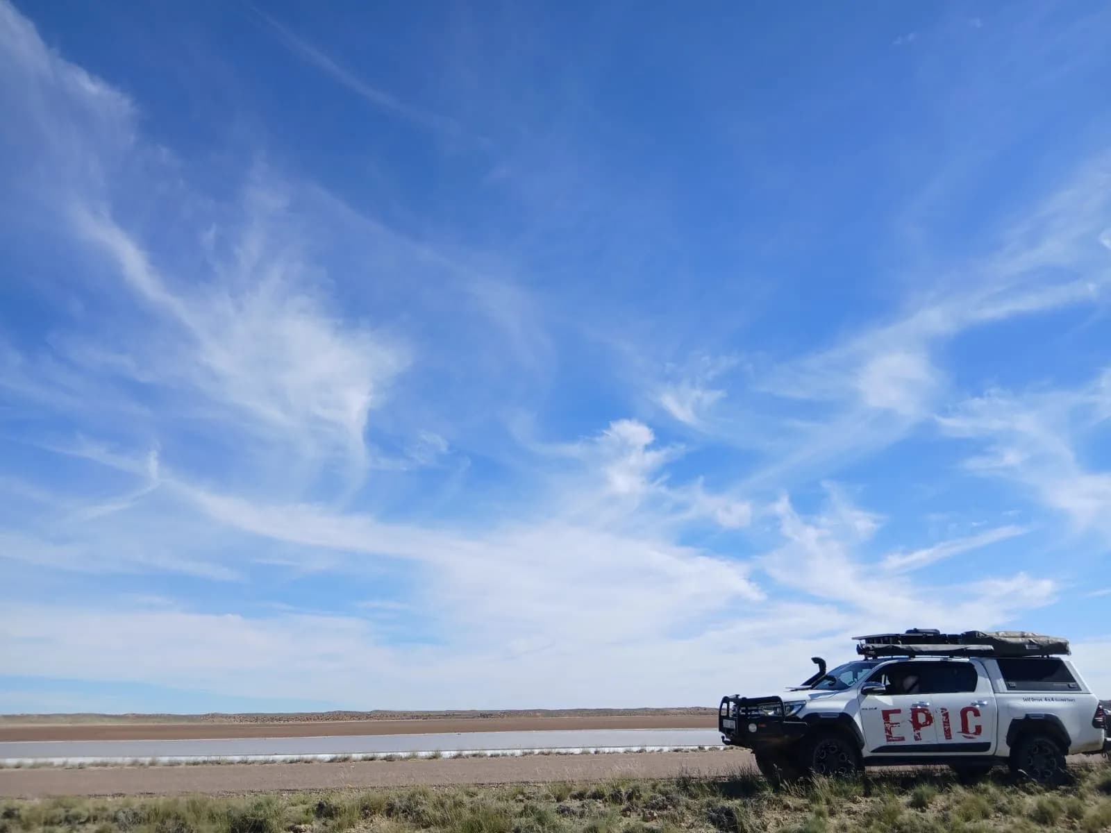 Toyota Hilux crossing the dunes on a West Coast expedition
